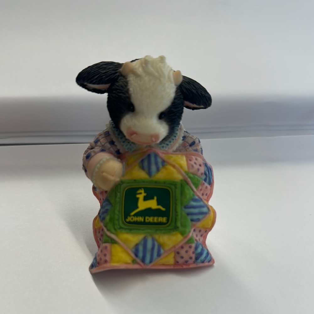 John Deere Cow Figurine with Colorful Quilt